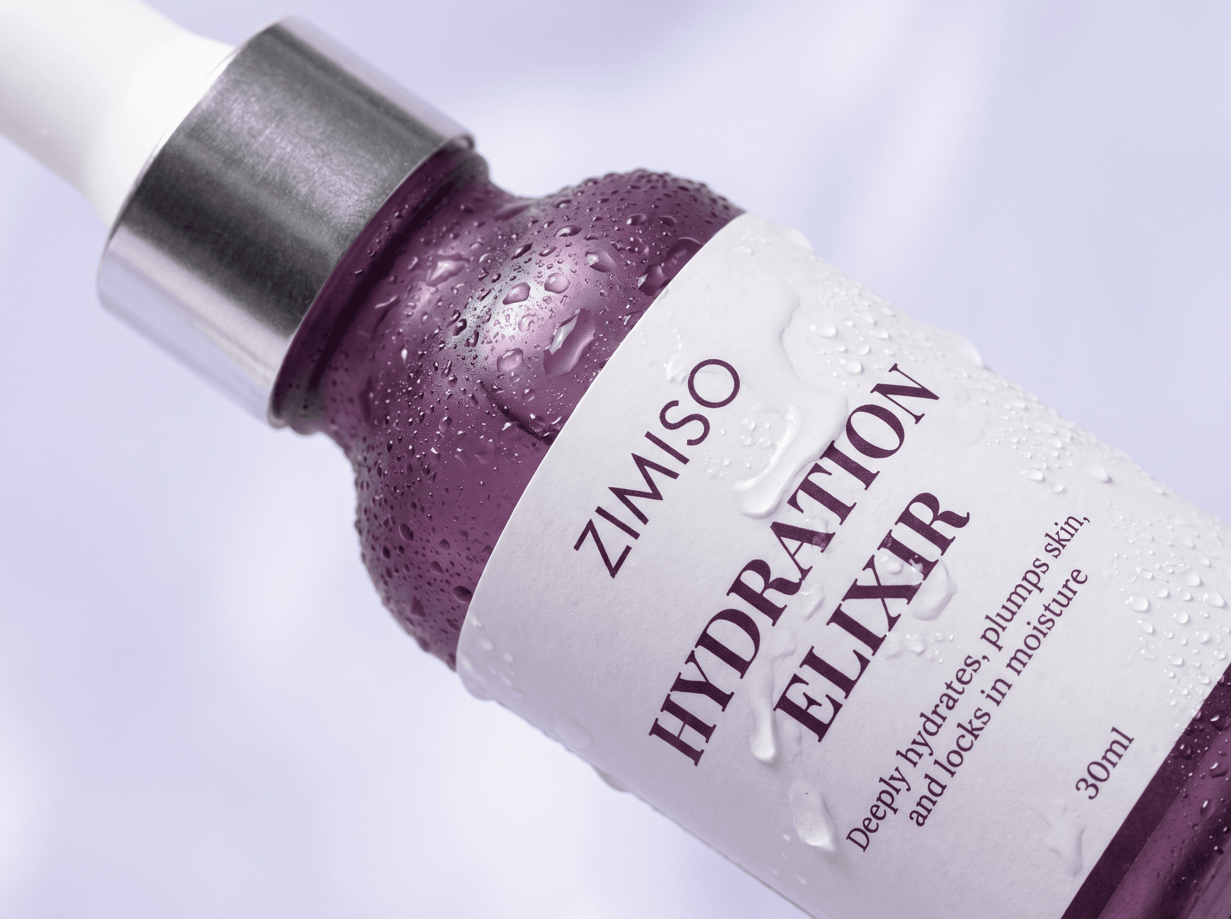 Macro close-up of the ZIMISO Hydration Elixir bottle beaded with condensation